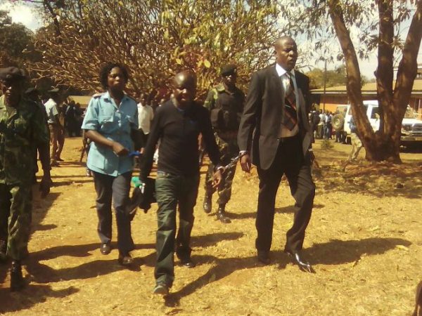 Manondo and Kumwembe handcuffed after conviction enroute to Prison