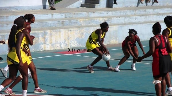 Martha Dambo posses the ball as Carol  Mtukule tries to block  her.....Photo Jeromy Kadewere