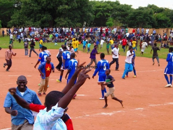 Fan celebrating the goal with pitch invasion - Photo by Jeromy Kadewere