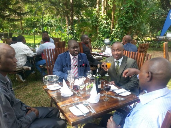 Mchulu and other journalists with Standard Bank officials at the luncheon