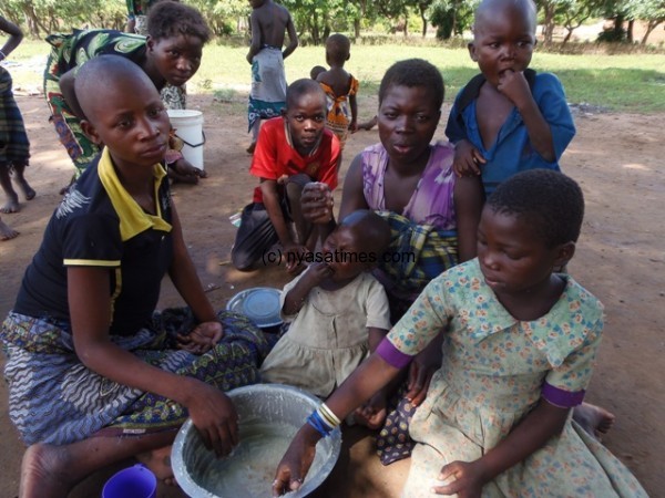 Flood victims having a meal.-Photo By Jeromy Kadewere, Nyasa Times