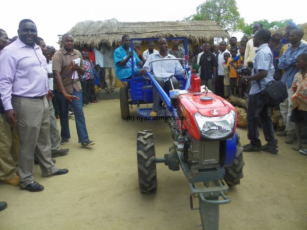 Member of the club appreciating the tractor