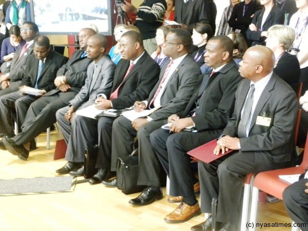 Members of the Malawi delegation keenly listens to President Banda