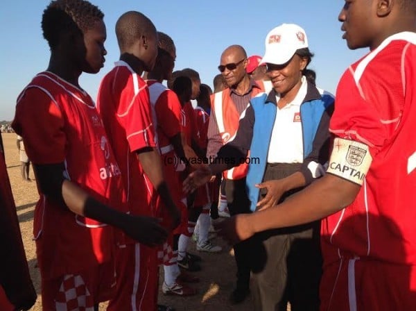 Minister of Sports Grace Chiumia and an Airtel official being introduced to the players