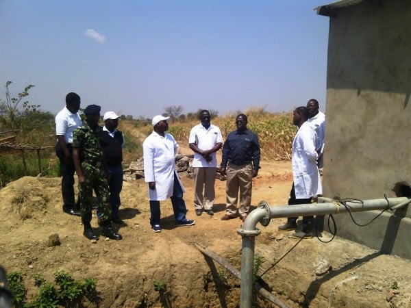 Minister of Agriculture Dr Allan Chiyembekeza (c) being briefed on the Solar-powered irrigation - pic by Gladys Kamakanda
