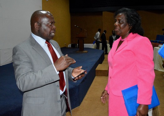 Minister of Education Science and Technology Dr. Emmanuel Fabiano and Mrs Lonely Magreta sharing notes as education reforms gets approved by President -