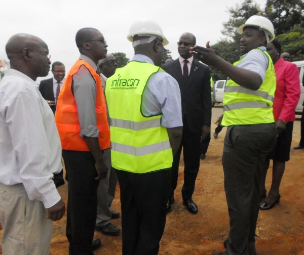 Minister of Lands, Housing and Urban Development Atupele Muluzi being briefed on the road project at Area 43 in Lilongwe - by Gladys Kamakanda