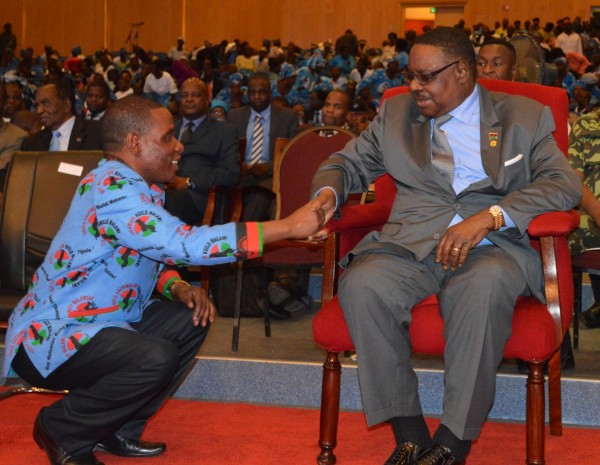 Minister of Trade and Industry Joseph Mwanamvekha congratulates President Peter Mutharika after the official launch of Buy Malawi Strategy (C)Stanley Makuti
