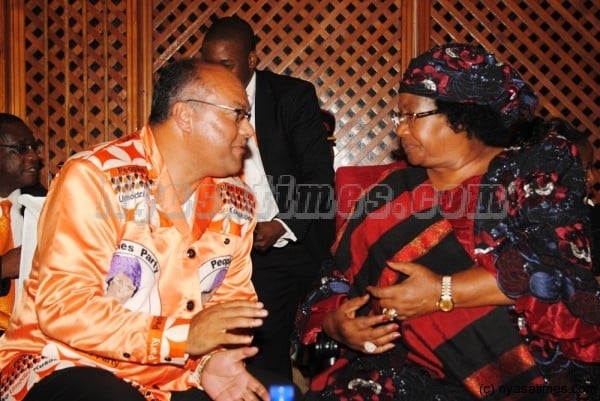 The past: Muhammad Sidik Mia  with President Joyce Banda: