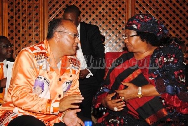 The past: Muhammad Sidik Mia  with President Joyce Banda: