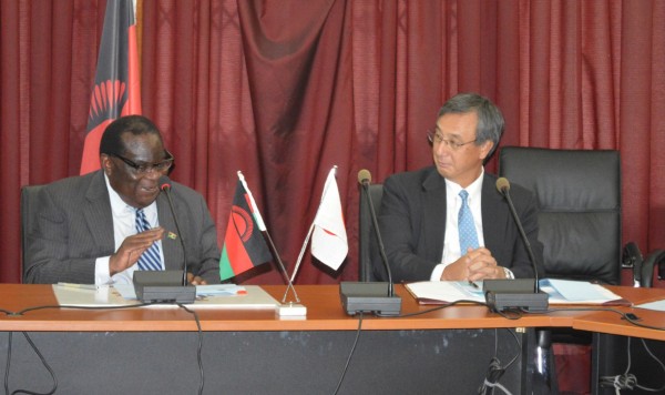 Minister of finance (R) in a discussion with Japanese Ambassodor to Malawi Shuichiro Nishioka at the Ministry of Finance (C) Stanley Makuti