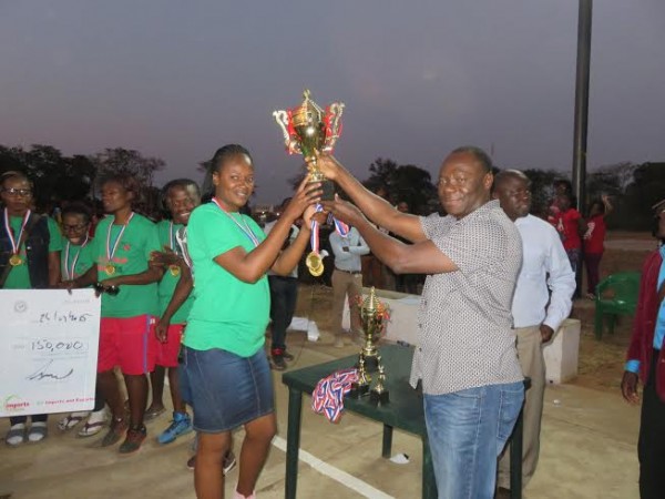 Moc President Oscar Kanjala presents trophy tpo Cezobal captain Cathy Makaniankhondo.