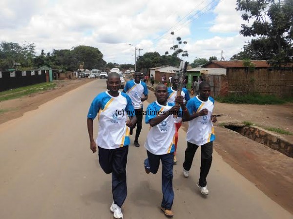 Malawi Olympic Committee accountant joins the relay, Pic Leonard Sharra