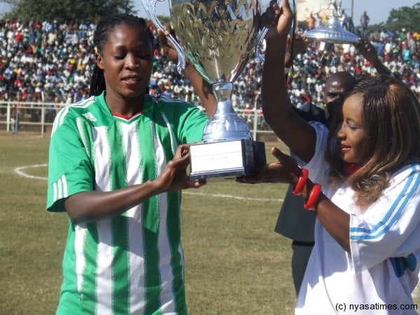 Models parading eith the trophy before the game  Photo by Elijah Phimbi, Nyasatimes