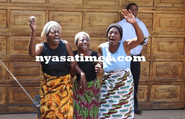 Mourners at the house...Photo Jeromy Kadewere