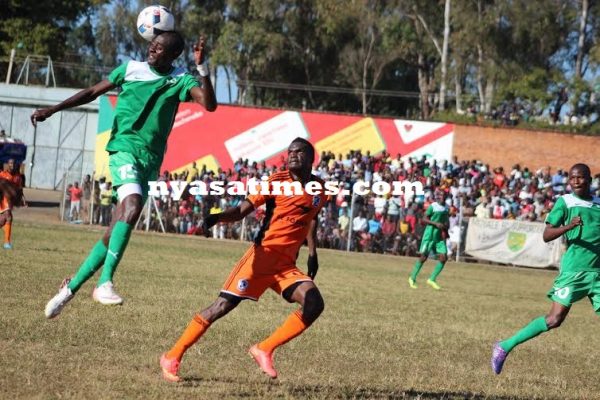 A Moyale defender clears the ball with the header...Photo Jeromy Kadewere.