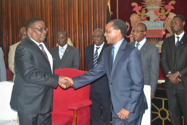 Mpinganjira (right) shakes hands with Mutharika after the donation.Pic-Francis Mphweya-MANA
