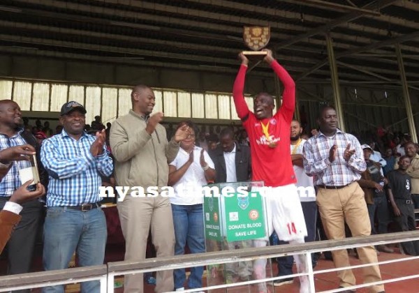 Msowoya lifts the  FA Malawi Chifundo Charity Shield- pix Alex Mwazalumo.