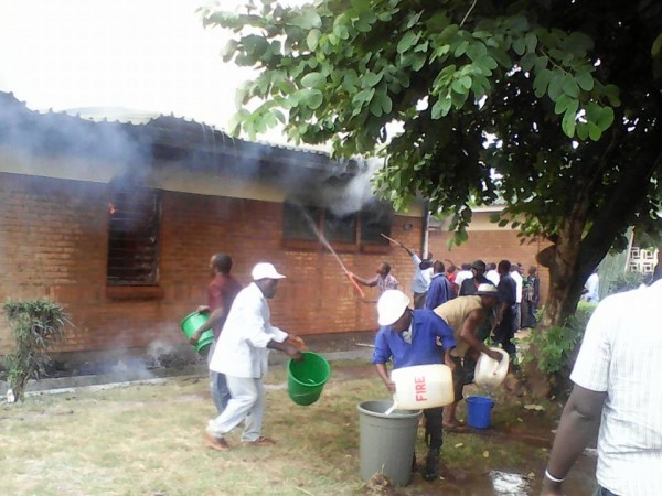 Staff tackle a fire at Mulanje hospital hostel