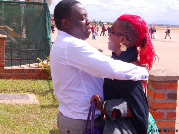 MultiChoice Malawi Marketing manager Chimwemwe Nyirenda with welcoming housemate Fatima after her evicton.-Photo by Jeromy Kadewere, Nyasa Times