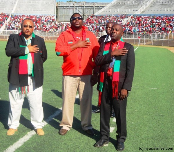 Malawi offcials pose for the national anthem before the match.-.Photo Jeromy Kadewere/Nyasa Times