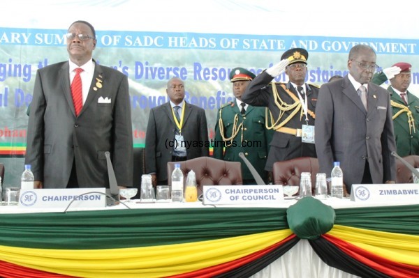 Missed out: Malawi President Peter Mutharika (L) who handed over SADC chairmanship to Zimbabwe president Mugabe