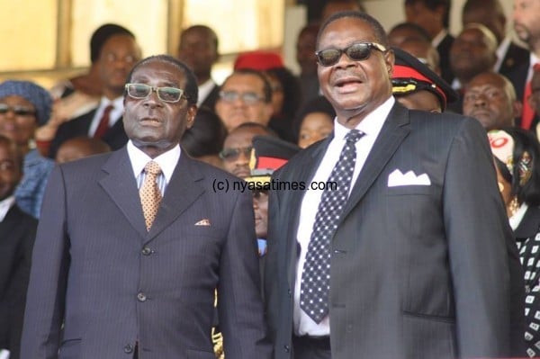 President Mugabe (left) calls for ICC withdraw but his Malawian coutnerpart Mutharika wont back that