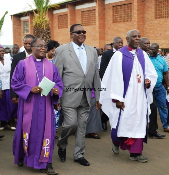 President Mutharika  led Malawians in observing Good Friday. On thje left is Bishop Joseph Bvumber