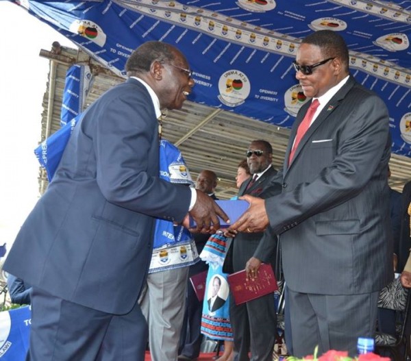 First malawian vice chancellor Brown Chimphamba receiving a medal of recognition from Mutharika during the function Pic-Francis Mphweya 