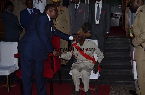 Mutharika with a war veteran