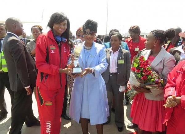 Mwai shows off her trophy with First Lady
