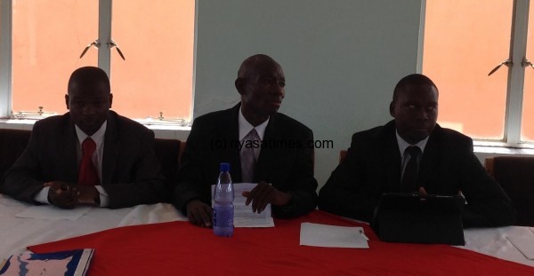 Humba (Centre) and Banda (right) with FAM finance manager Chris Mdolo at the briefing