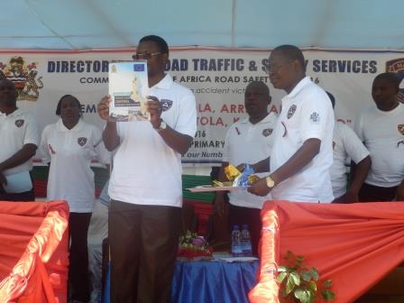 Ndau showing off the book containing information on preventing road accidents. Pic Sellah Singini (MANA)