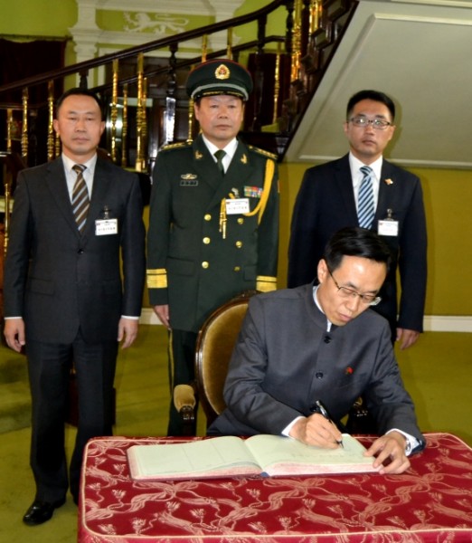 New Chinese Ambassador to Malawi, Mr. Wing Shiting, signs in the Visitors` book at Kamuzu Palace in Lilongwe-(c) Abel Ikiloni, Mana