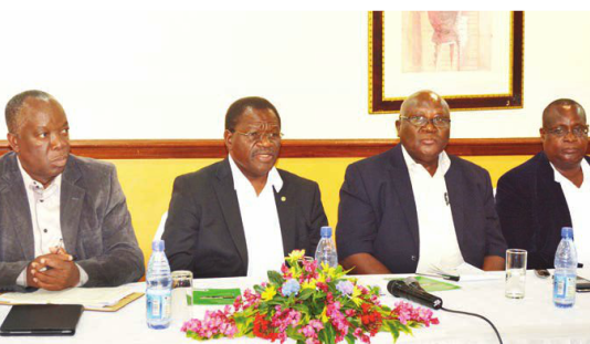 Kandulu (second frm left) addressing the news conference