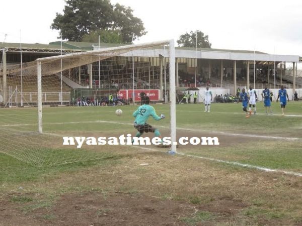 Ngozo is beaten by Simkonda's penalty kick.
