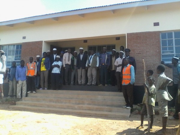 Ngulube( in white shirt) posing with community members at Katema CVSU,pic by Sellah Singini,MANA