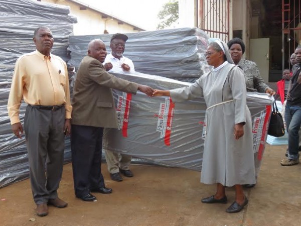 Njikho makes a symbolic presentation to Likuni hospital.