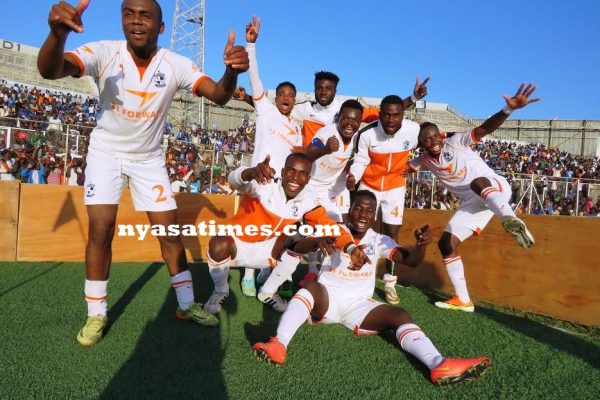 Nomads players celebrate