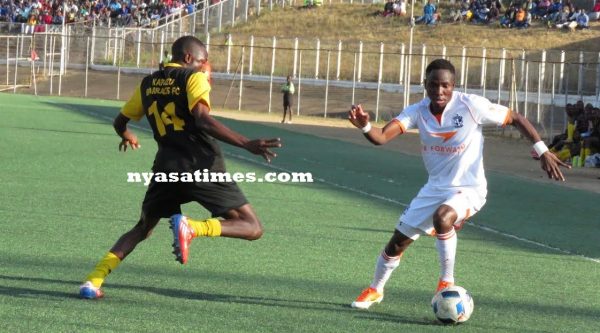 Nomads player beats KB opponent with a dummy.l-Photo by Jeromy Kadewere, Nyasa Times