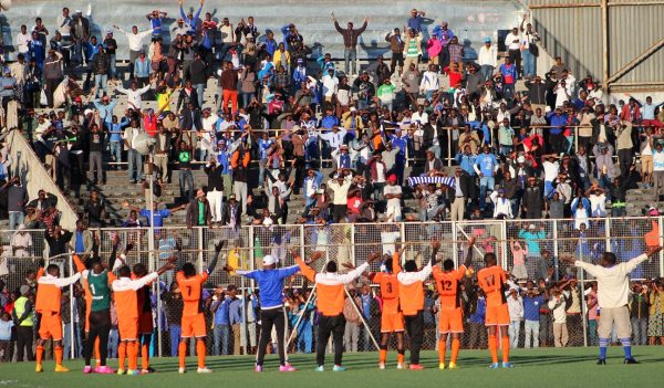 Nomads players led by Team manager Steven Madeira celebrating with their fans after the game...Photo Jeromy Kadewere