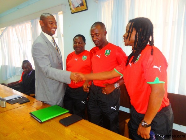 Nyamilandu shakes hands with Mtawali as Mabedi and Ng'onamo looks on. -Photo by Jeromy Kadewere/Nyasa Times