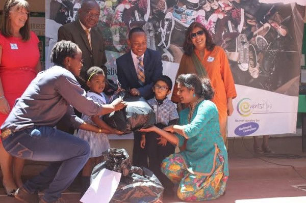 Nyasa Acadamy pupils presenting the shoes to Mayor Chalamanda