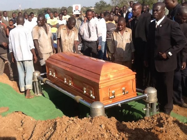 Nyondo's casket being lowered