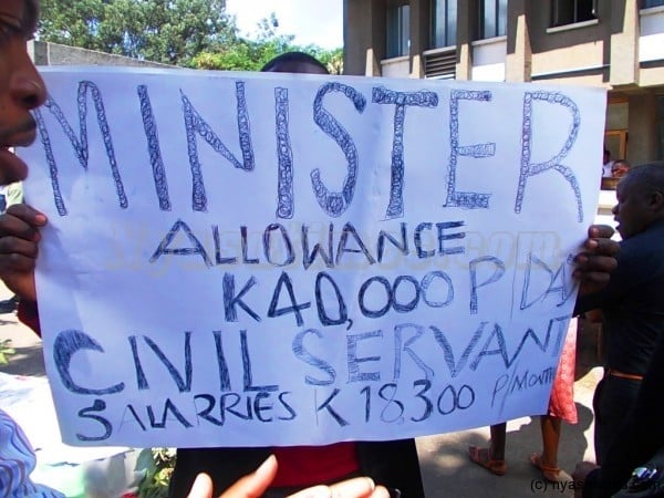 Civil servants carrying one of the placard in Blantyre on Monday.-Photo by Jeromy Kadewere/Nyasa Times