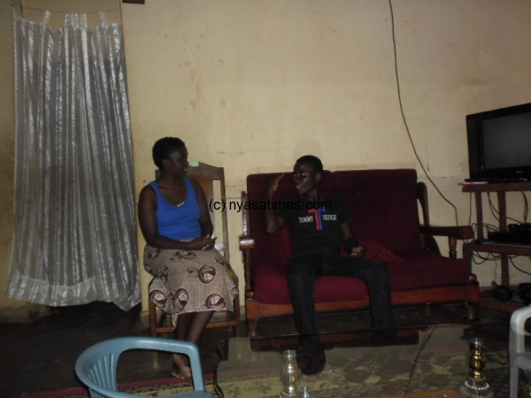 One of the family members Left trying to get sense from  a brother who has some hearing impairment-Pic by Henry Nkhata