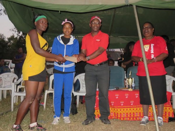 One of the outsanding players gets her prize from Airtel Money
