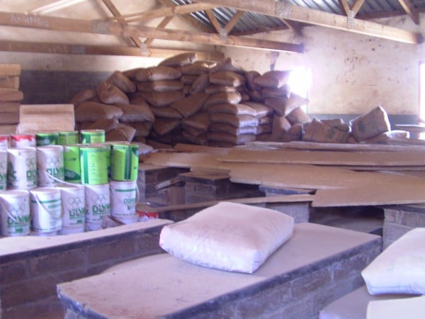 Over 400 bags of cement and several tins of paint wasted - pix by LINA