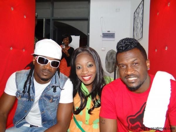 P-Square duo with Malawian fan, Kheliwe Murimu, Group Public Relations Manager of Techno Brain