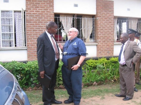 Government official with Walker after the meeting.-Photo by Tiwonge Kumwenda, Nyasa Times